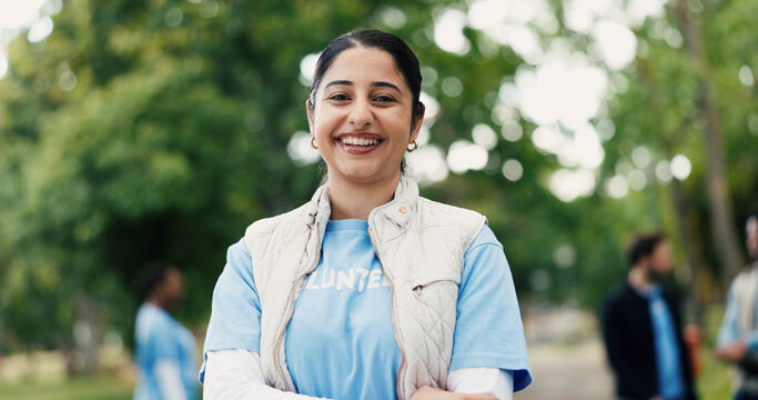 Portrait, woman and volunteer with smile at park for community service, charity outreach and ngo. Happy, female person or earth day project for environment cleanup, social responsibility and about us