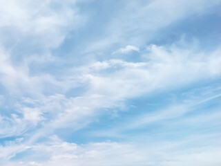 Soft blue sky with gentle white clouds creating a calm, airy, and minimal background perfect for design, nature themes, and serene atmospheres.