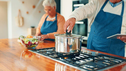 Pot, hand and man with couple cooking together in home, check supper and tablet for online tutorial. Person, old woman and meal prep with tech for food blog, healthy snack or dinner in retirement