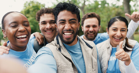 Volunteer team, people and selfie with thumbs up for community service, success or laugh. Charity group, portrait and picture at park with like hand gesture for NGO, funny and social media with POV