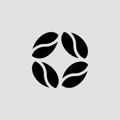 Four coffee beans arranged in a circle isolated on