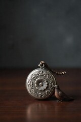 Generational heirlooms, passed down through time, symbolizing family legacy and enduring bonds in a still life. A still life arrangement featuring a tarnished silver locket, a worn leather bound