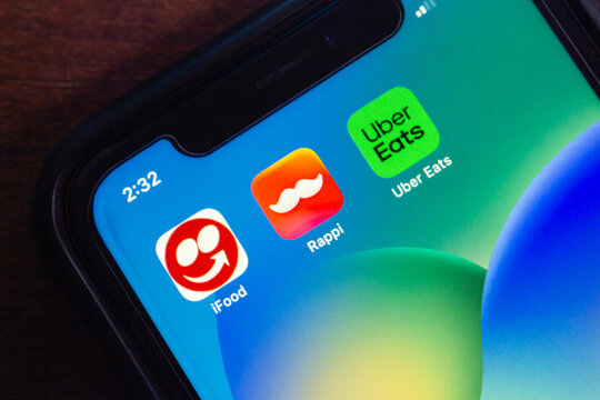 Mexico City, MEXICO - Sep 21 2025 : Close-up of iPhone screen showing iFood, Rappi, and Uber Eats app icons, representing food delivery and mobile ordering services in Latin America.