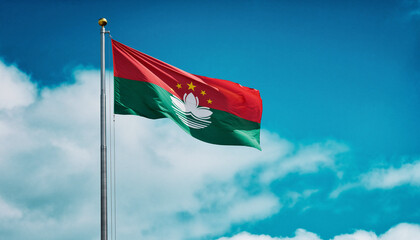 A realistic photograph of the Macau flag waving on a tall metal pole against a bright blue sky with clouds