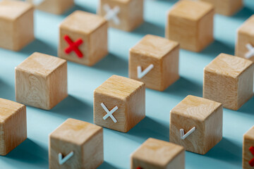 Wooden blocks with check marks and crosses symbolizing decision-making and evaluation concepts arranged on a soft blue surface representing choices and correctness