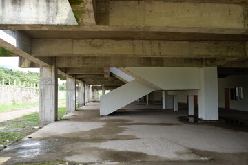 Raw Concrete Structure Under Construction with Staircase and Pillars Architecture