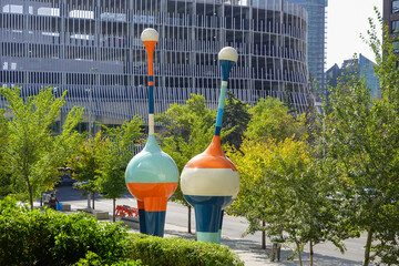 Colorful urban park installation with city buildings