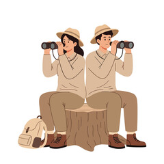 a couple hiking with backpacks and binoculars