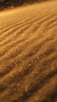 Cinematic macro view panning across intricate wavy patterns of arid sand dunes softly shifting due to subtle air currents and wind tan, arid, pattern
