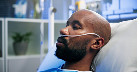 Man, breathing tubes or sleeping on hospital bed for post surgery, healthcare or recovery. Sick...