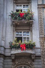 The balconies of the old and historical building decorated for Christmas. Christmas celebration preparations.