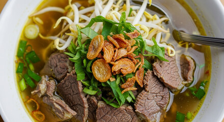 Delicious soto daging with Tender Beef, Bean Sprouts, and Crispy Shallots in Clear Broth