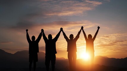 Silhouetted group celebrating success at sunset, dynamic teamwork and achievement video, 4K