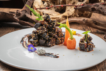 Black pepper squid ink yak cubes