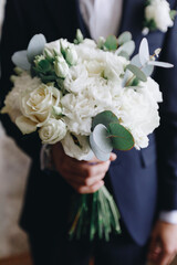 Wedding bouquet with white roses on table