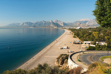 Naklejka premium Aerial view of Konyaalti beach and pine-covered coastline at sunrise in Antalya