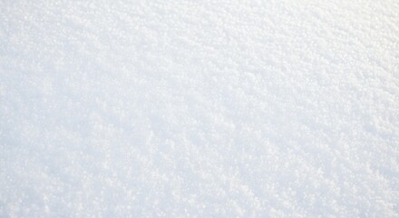 Close-up of a snow-covered surface, showing the texture and details of the snow crystals, creating a wintery and cold atmosphere.