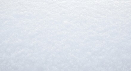 A close-up shot of a snow-covered surface, showcasing the texture and patterns created by the snow crystals.