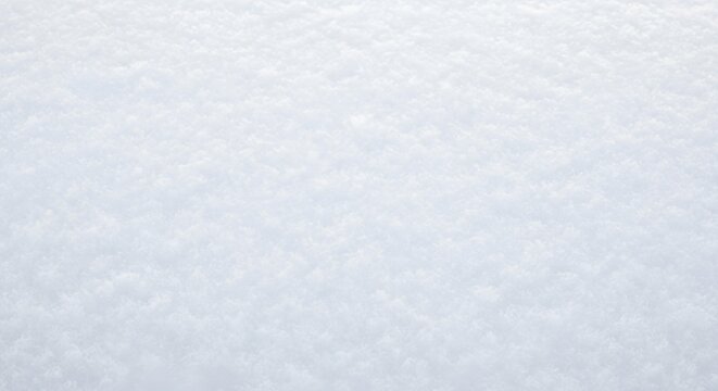 A close-up shot of a snow-covered surface, showcasing the texture and patterns created by the snow crystals.