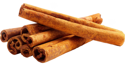 A cluster of fragrant cinnamon sticks, textured and curled, piled together on a dark surface