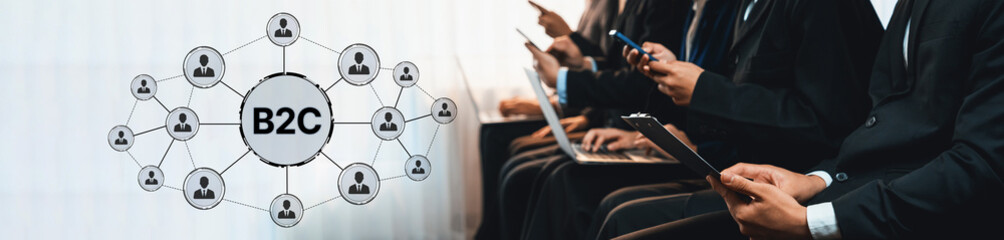 A professional team engaged in business to consumer marketing strategy using technology in a modern...