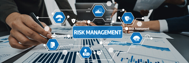 Analyst team working on BI Fintech to analyze financial dashboard paper at office workplace. Businesspeople reviewing report paper on table for business insight. Panorama shot. Prodigy Amity