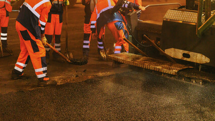 Road workers paving Tverskaya Street in Moscow during the night