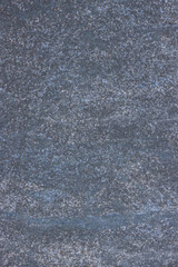 Rough textured surface of flat grey stone tile