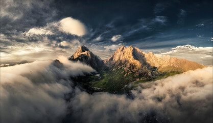 Majestic Peaks Emerging from Clouds - Dramatic Mountain Landscape