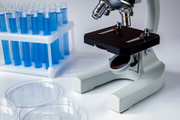 microscope in the laboratory with test tubes