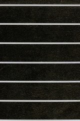 Shiny metal parallel lines on dark background