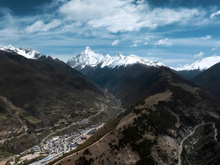 Snow-Capped Peaks and Winding Roads in Sichuan Valley, China