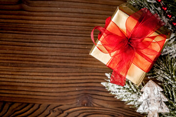 packaging christmas gifts in boxes on wooden background top view