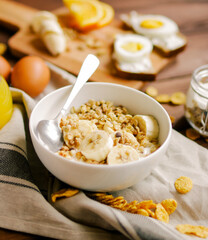 healthy breakfast bowl of yogurt with granola and eggs