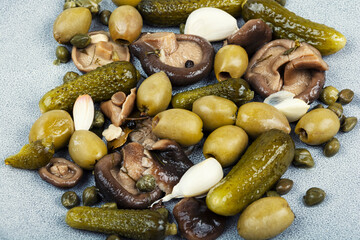 Marinated olives mushrooms and cucumbers, salted mushrooms