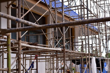 Scaffolding for building improvements, Renovation scaffolding enveloping historical building facade