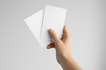 Fototapeta premium Hand holding blank business cards for mock up design presentation
