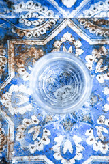 Calm setting showcasing drink amid detailed ceramic and pastel shades