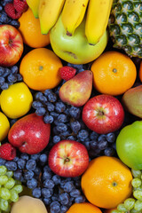 Fruits and berries as background, top view. Healthy food concept