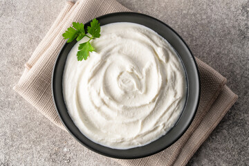 Traditional yogurt, full-fat or nonfat. Yogurt made from cow's or goat's milk on vintage background	