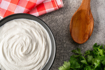 Traditional yogurt, full-fat or nonfat. Yogurt made from cow's or goat's milk on vintage  background