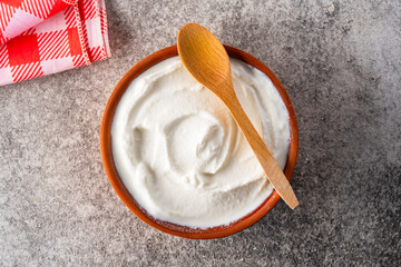 Traditional yogurt, full-fat or nonfat. Yogurt made from cow's or goat's milk on vintage  background