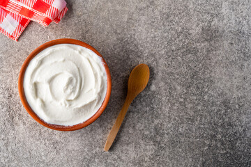Traditional yogurt, full-fat or nonfat. Yogurt made from cow's or goat's milk on vintage  background