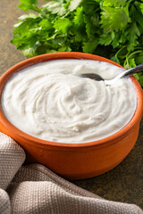 Traditional yogurt, full-fat or nonfat. Yogurt made from cow's or goat's milk on vintage background	