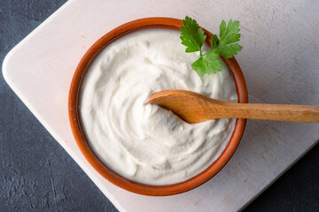 Traditional yogurt, full-fat or nonfat. Yogurt made from cow's or goat's milk on black background	
