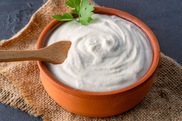 Traditional yogurt, full-fat or nonfat. Yogurt made from cow's or goat's milk on black background	
