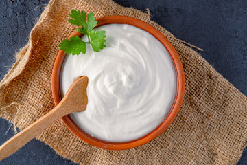 Traditional yogurt, full-fat or nonfat. Yogurt made from cow's or goat's milk on black background