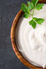 Traditional yogurt, full-fat or nonfat. Yogurt made from cow's or goat's milk on black background