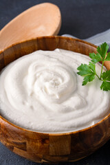 Traditional yogurt, full-fat or nonfat. Yogurt made from cow's or goat's milk on black background