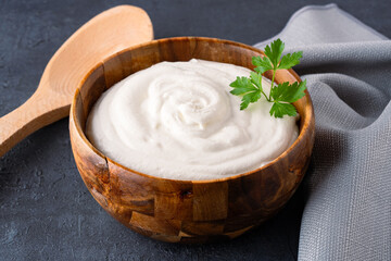 Traditional yogurt, full-fat or nonfat. Yogurt made from cow's or goat's milk on black background